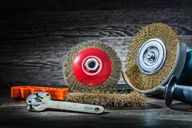 abrasive wire tools set on vintage wood background clipart