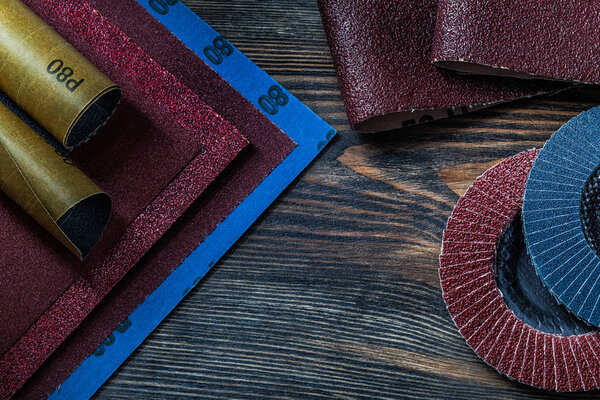 abrasive  tools sand paper and abrasive wheels on vintage wood