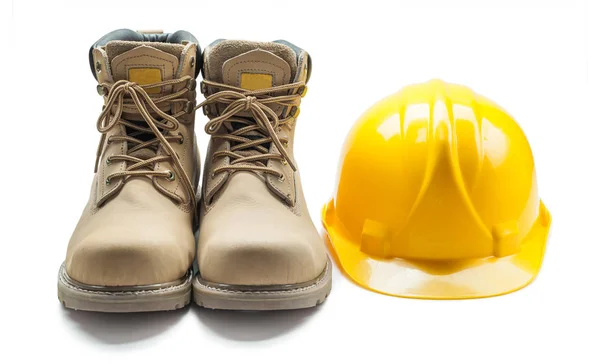 Construction tools leather working boots and yellow helmet isola — Stock Photo, Image