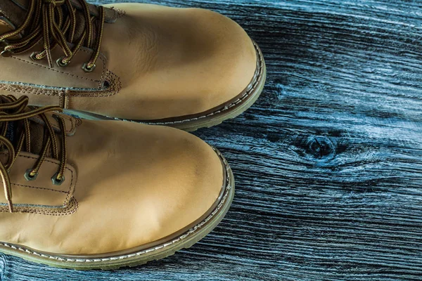 Protective boots on wooden board — Stock Photo, Image