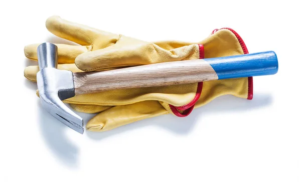 Claw hammer on yellow  leather gloves isolated — Stock Photo, Image