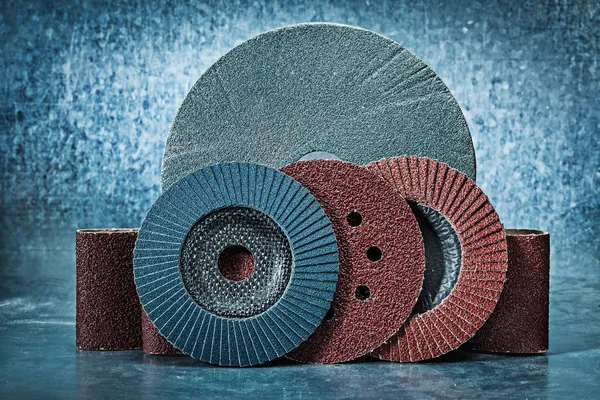 Abrasive discs and tapes on metalic background — Stock Photo, Image