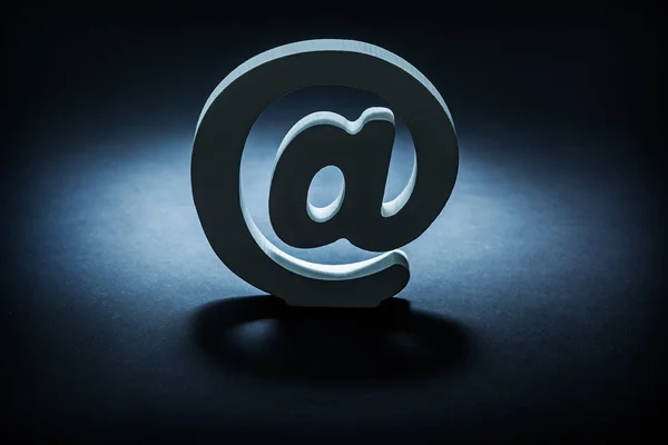 Email symbol on dark gradient gray black background — Stock Photo, Image