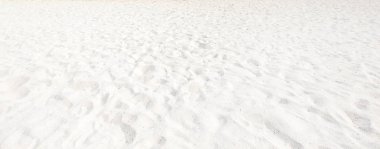 Sahilde kum, arka plan olarak