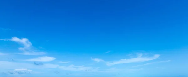 blue sky background with tiny clouds