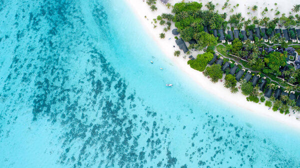 Beautiful aerial view of Maldives and tropical beach . Travel an