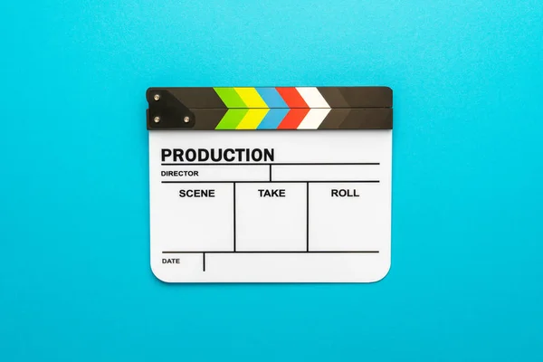 White clapperboard as filmmaking concept on turquoise blue background copy space — Stock Photo, Image