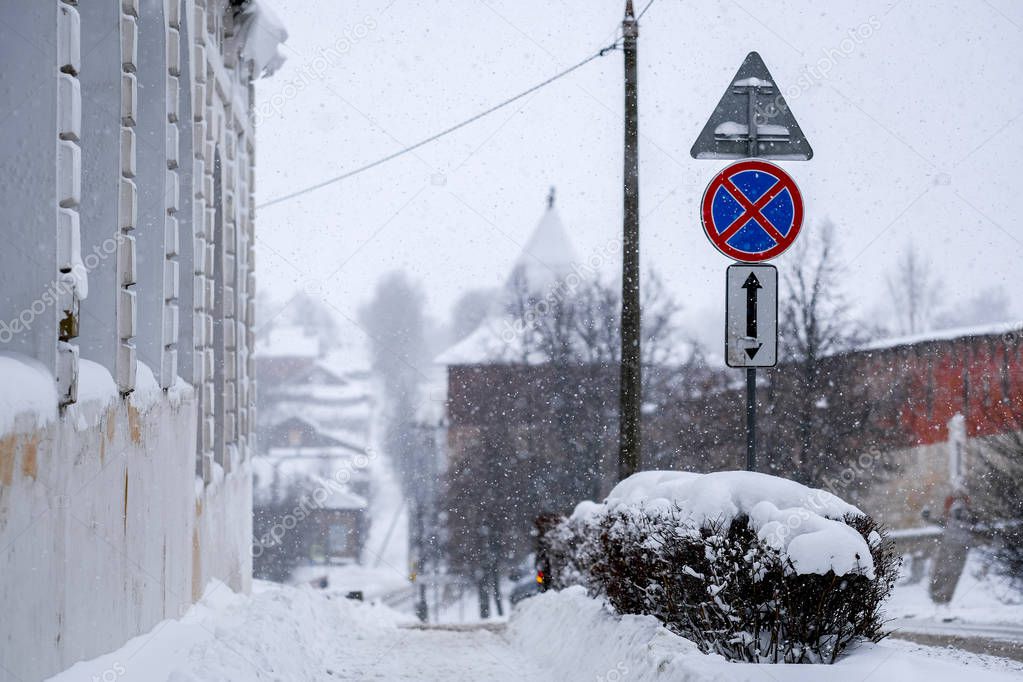 Russia, Zaraysk - January, 4, 2019: the image of cars on the parking near the building in the city of Zaraysk in snowfall
