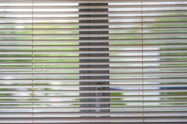 The image of the blinds on a window
