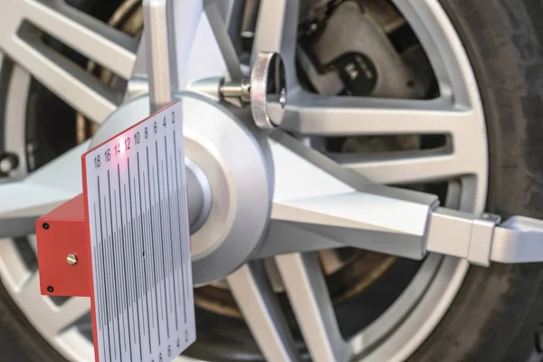 wheel alignment equipment is on the car wheel close up