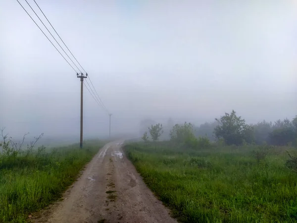 image of a country road in bad weather