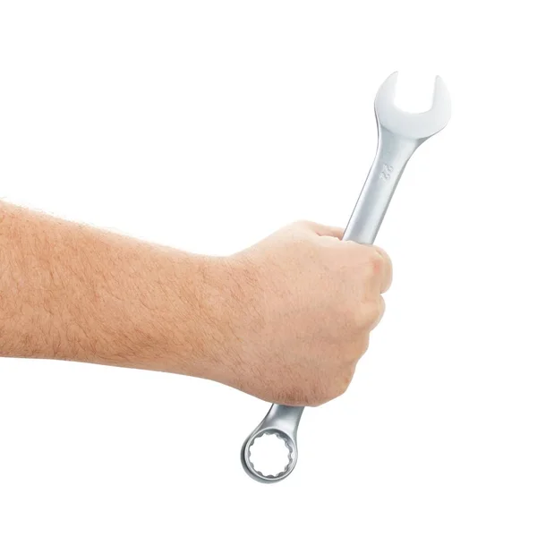 Mechaniker hält Schraubenschlüssel in der Hand auf weiß — Stockfoto