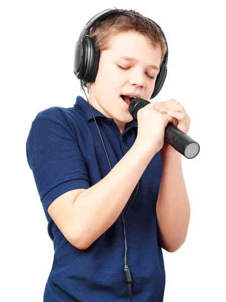 Teenage boy singing into a microphone. Very emotional. — Stock Photo, Image