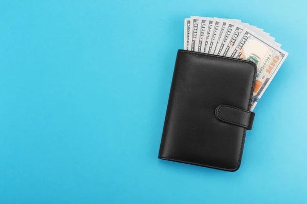 Black leather wallet with dollars cash — Stock Photo, Image