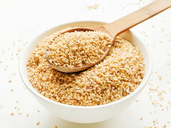 Bowl with wheat groats — Stock Photo, Image