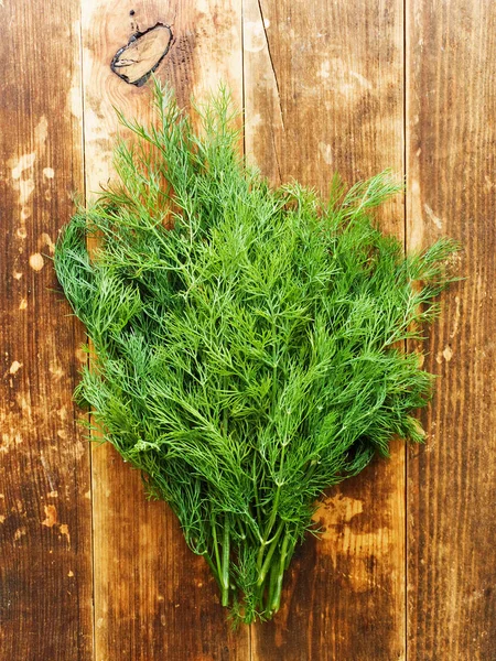 Dill on wood — Stock Photo, Image