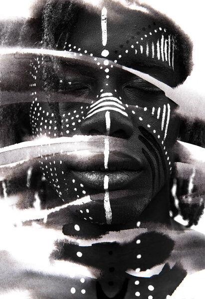 Paintography. African man with traditional style face paint dissolving behind ink brush strokes