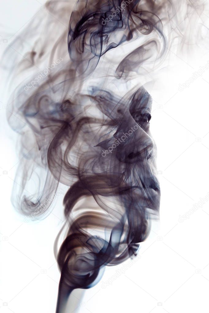 Black and white, unique conceptual work bringing together the unpredictable nature of smoke with the firm gaze of a young man