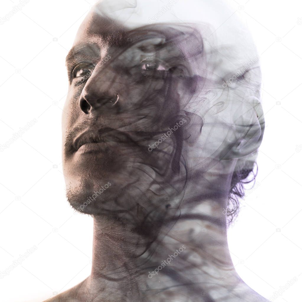 Unique conceptual work bringing together the unpredictable nature of smoke with the firm gaze of a young attractive man with flawless sunkissed skin