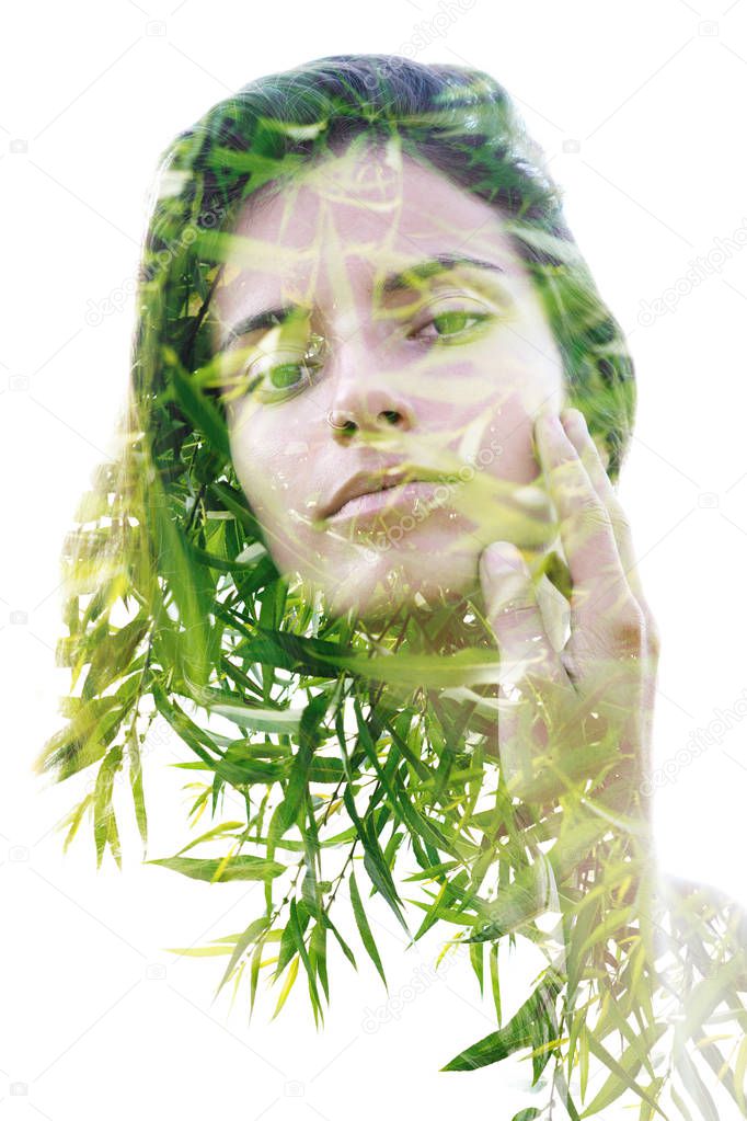 Bright and sunny landscape combines with female face. Double exposure