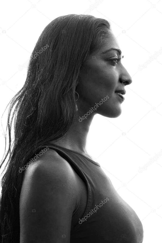 Her stunning profile is captured against a white background