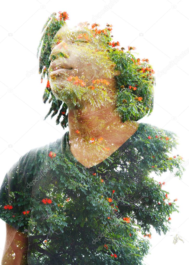 Double exposure of a dark skinned man with dreadlocks combined w