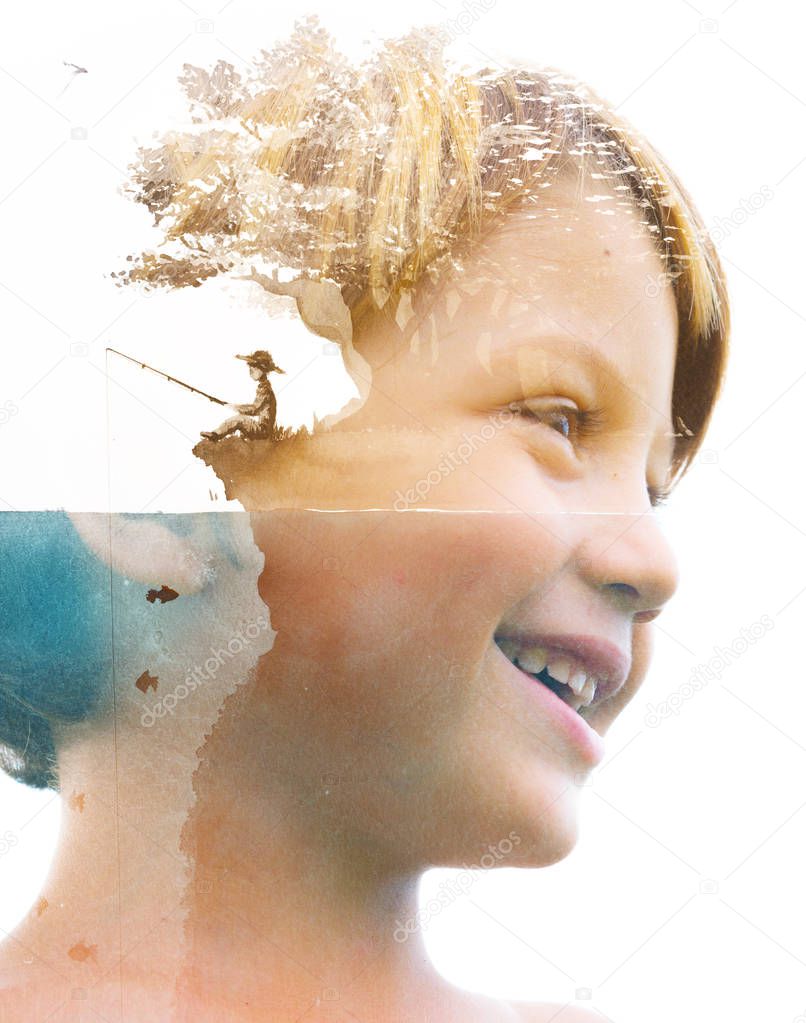 Double exposure portrait of a young smiling child combined with 