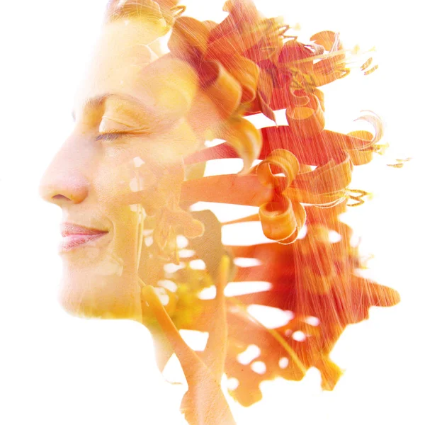 Double exposure profile of a natural beauty with lush orange flo — Stock Photo, Image