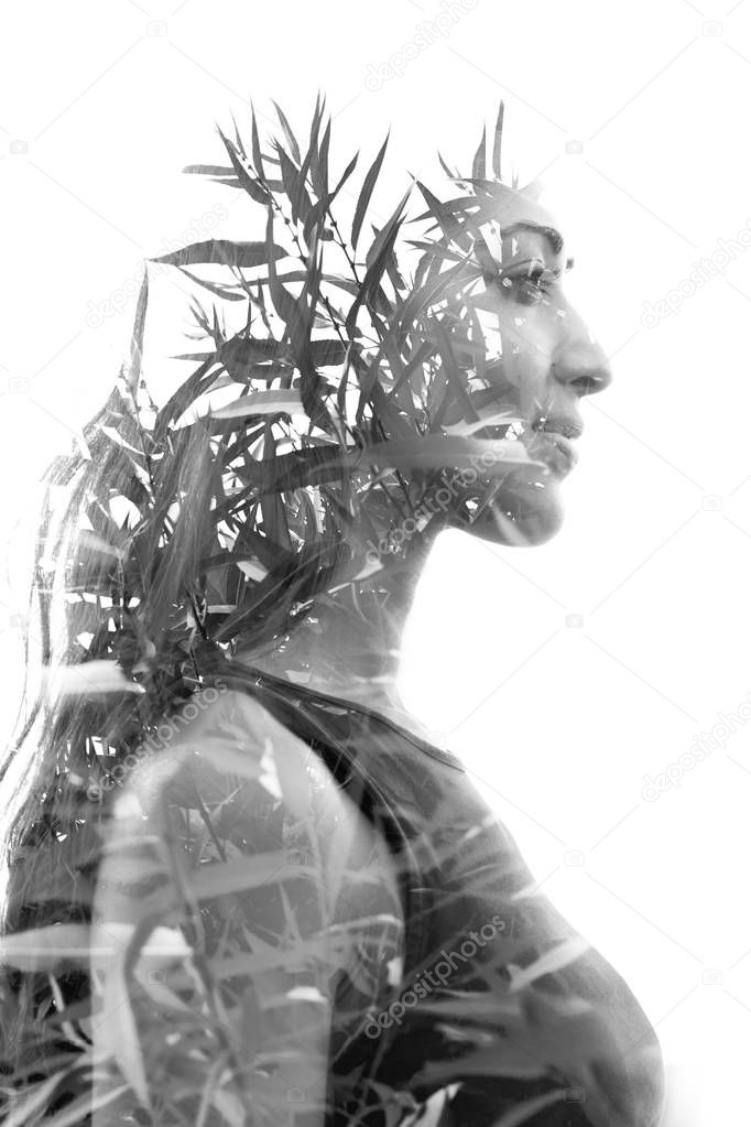 Double exposure profile portrait of a naturally beautiful happy 
