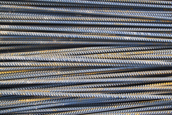 top view of the reinforcing steel bar stack close-up, rebar for concrete construction works piled on top of each other