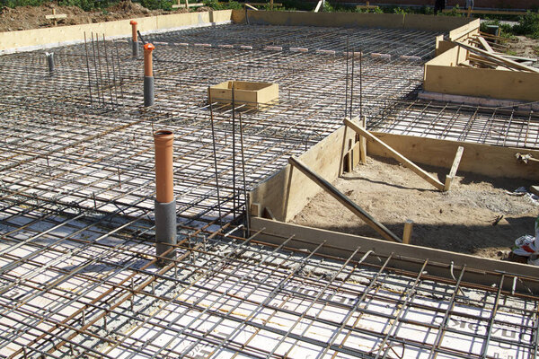 close up view of reinforcement of concrete with metal rods conne