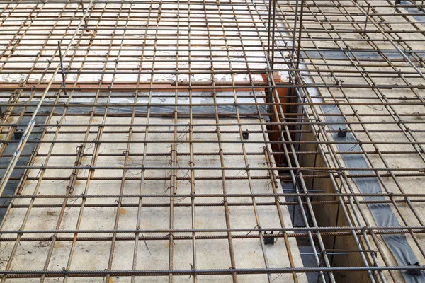 Reinforcement of concrete with metal rods connected by wire. Pre — Stock Photo, Image