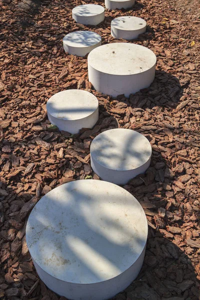 Modern minimalist path of round stones in the Park leading on th — Stock Photo, Image