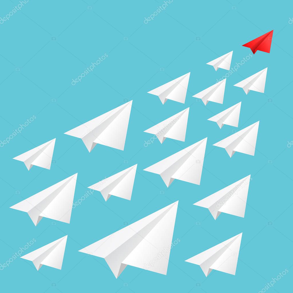 concept of leadership. leading red paper airplane flying white planes aimed at a common goal