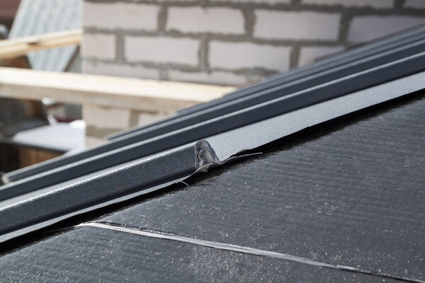 close up view of the seam roof under construction on the waterproofing layer