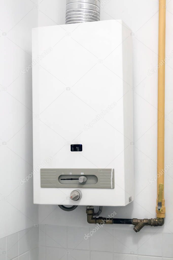 gas boiler water heater hanging on the wall in the bathroom