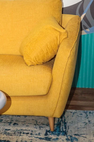 close-up view of a yellow pillow on a sofa in a modern interior