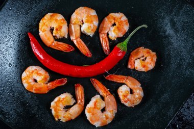 Grilled prawns with chili pepper. Royal delicious and beautiful shrimp. Flatley. Food background clipart
