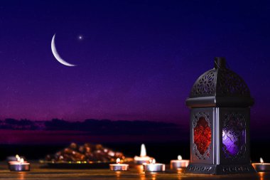 Ornamental dark Moroccan, Arabic lantern and dates on on an old wooden table with the night sky and the Crescent moon and the stars behind. Greeting card for Muslim community holy month Ramadan Kareem clipart