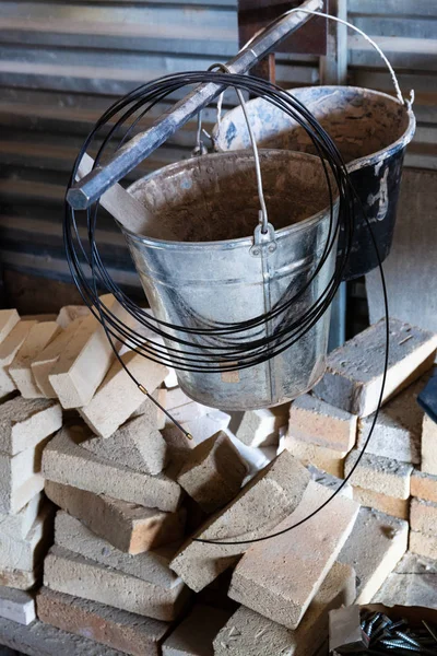 Buckets, wire and bricks — Stock Photo, Image