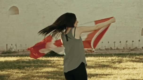 Girl dancing with Canada nation flag — Stock Video