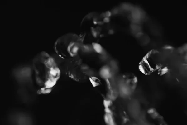 Water drops in air in dark — Stock Photo, Image