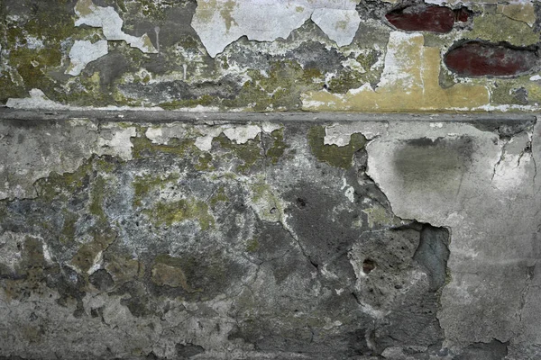 Wall covered with spots of scratched plaster and paint — Stock Photo, Image