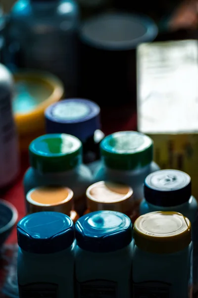 Caps of medicine bottles backlit selective focus — Stok Foto