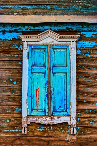 Obsolete window painted in worn blue color — Stock Image Obsolete window painted in worn blue color Royalty Free Stock Images