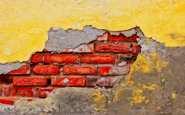 Building wall with half broken palster