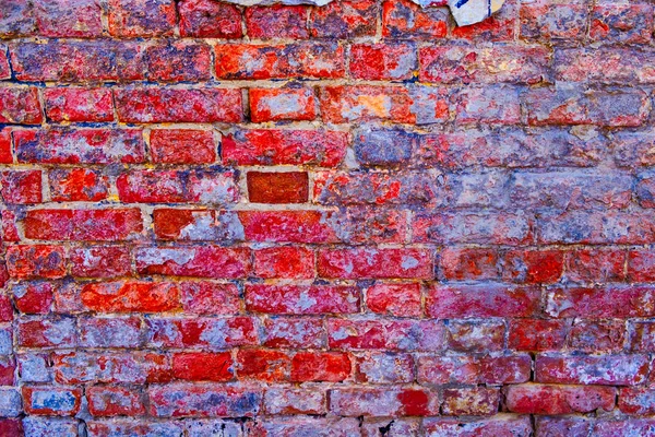 Worn aged brick wall of bright red-pink colour — Stock Photo, Image