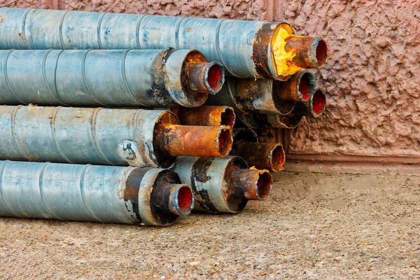 Worn hot water pipes in stack — Stock Photo, Image