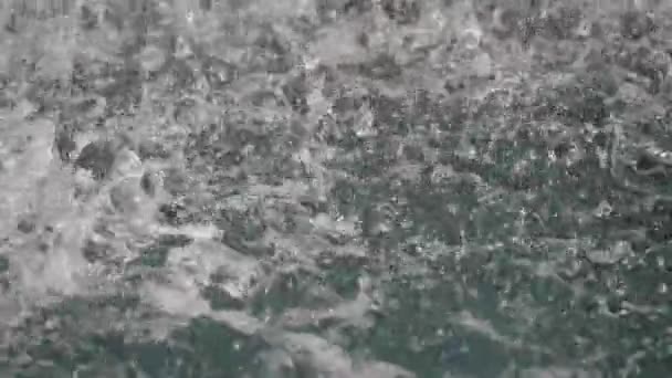 Fountain pond surface disturbed by falling waterdrops — Stock Video