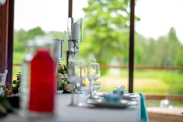 Candles and dishes on the festive table — Stock Photo, Image